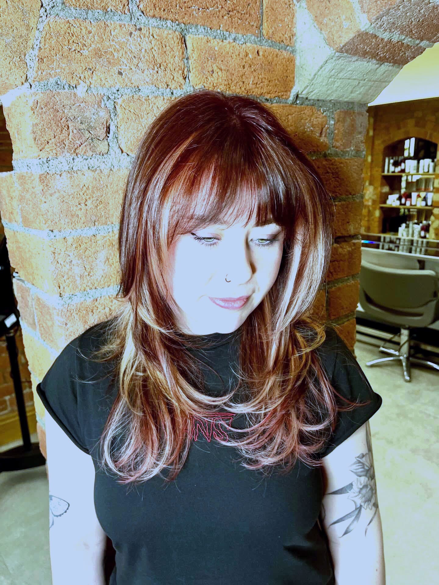 Red-copper colour with a curtain fringe, lit with flash at the brick arch.